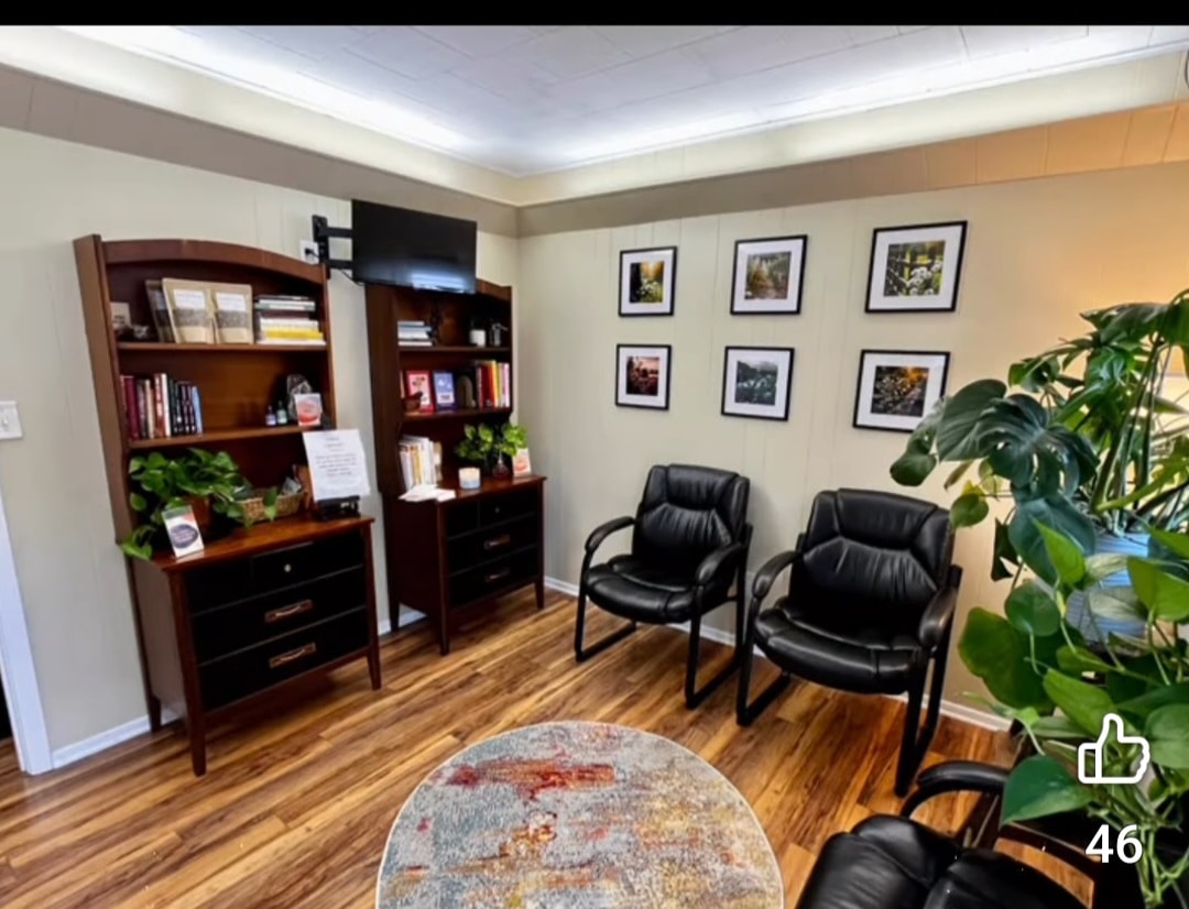 Caring medical professional with a patient family in a warm clinic setting